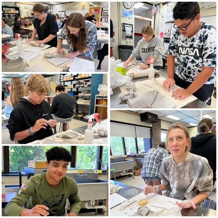 Ceramics 2 students working hard on their “Totem Spoons."